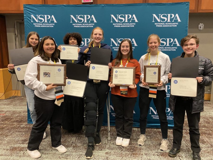Newspaper+and+yearbook+staff+members+showcase+their+awards+at+the+JEA%2FNSPA+National+High+School+Journalism+Conference.+Those+who+attended+included+Kaitlyn+Sitton%2C+Maya+Ortiz%2C+Ana+La+Rosa+Grillo%2C+Arleigh+Doehring%2C+Taylor+Nethery%2C+Katie+Gerbasich+and+Fallon+Head.