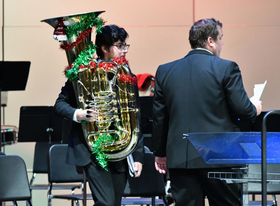 Jace Rodriguez, 11, cleans up after the band concert on December 8.

