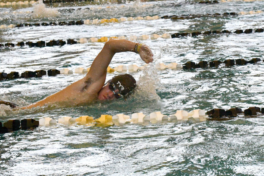 Senior Ian Ganem swims during the first warm-up meet of the season. He was one of the top runners on the cross country team a year ago before suffering an injury.