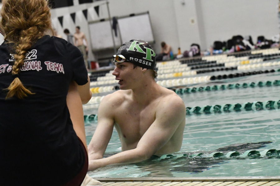 Senior Chris Rosser takes a break after racing in the Senior Night meet.