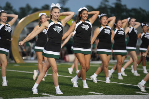 Cheerleaders participate in the outdoor homecoming pep rally. They had a strong finish at the state competition this year. 