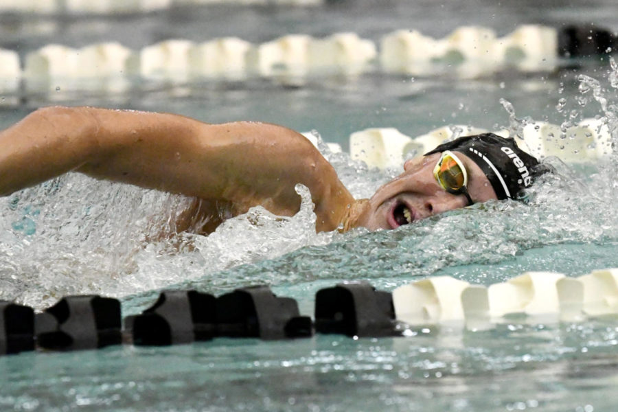 Senior Joe Stephenson competes in the freestyle during the Senior Night swim meet. He is one of two seniors who qualified for state this year. 