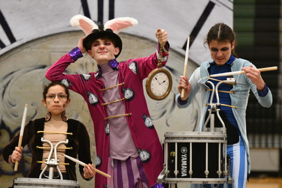 Victoria Ramos and Josh Chavez play their drums as Ean Osbourn, the bunny, dances.