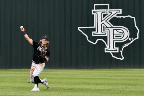 Senior shortstop Marshall Burke makes a throw during the Kingwood Park baseball tournament. 