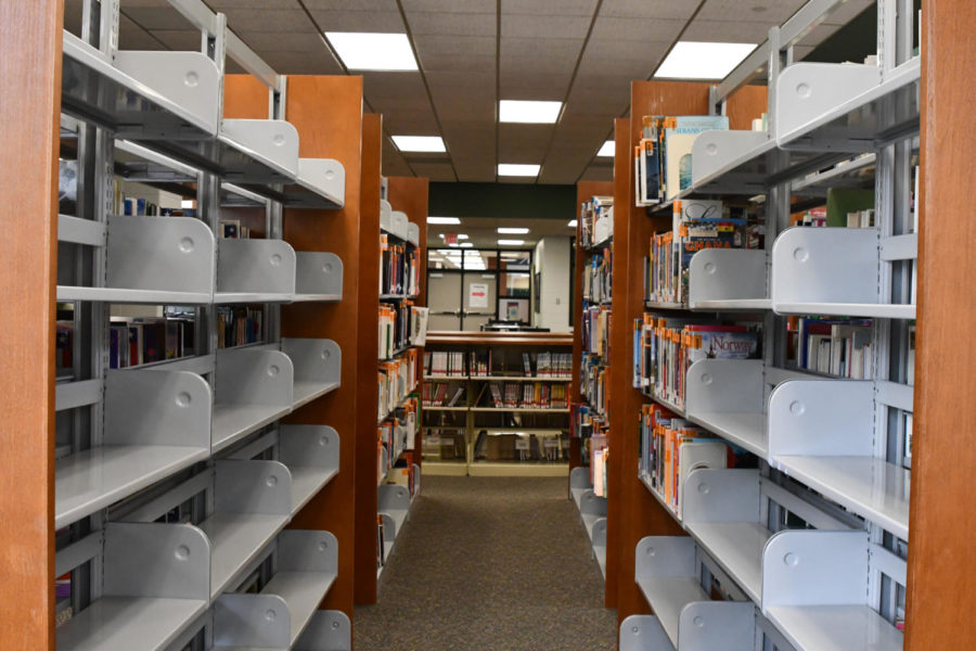 Books are being cleared from the bookshelves and boxed up. They will be housed in an off campus warehouse until construction on the front entrance is finished.