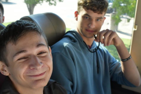 Seniors Caleb Miller and Kyle Erickson hang out on the bus during a JROTC field trip in the fall. Miller is enlisting into the Navy and Erickson is enlisting in the Army. 