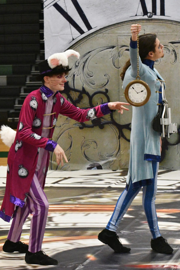 Ean Osbourn, playing the bunny in the K-Pipe Alice and Wonderland performance, tries to steal the clock from Alice, played by Josh Chavez.