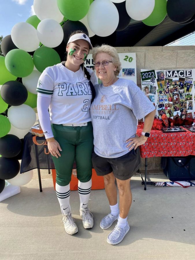 Senior Hannah Leierer enjoys Senior Night with pitching coach Annie Castle. Leierer has taken weekly lessons from Castle since she was 9 years old.