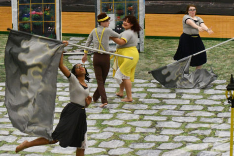The color guard performed a preview of their show for the community before they went to the area competition. 