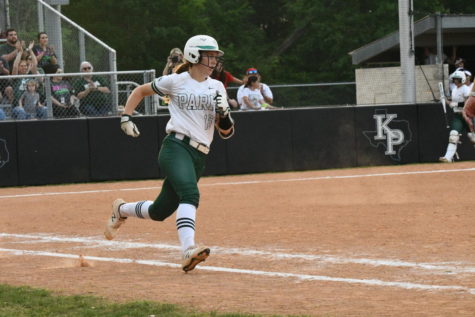 Sophomore Abbey Papadimitriou looks to round first base after hitting the ball against Lufkin. 