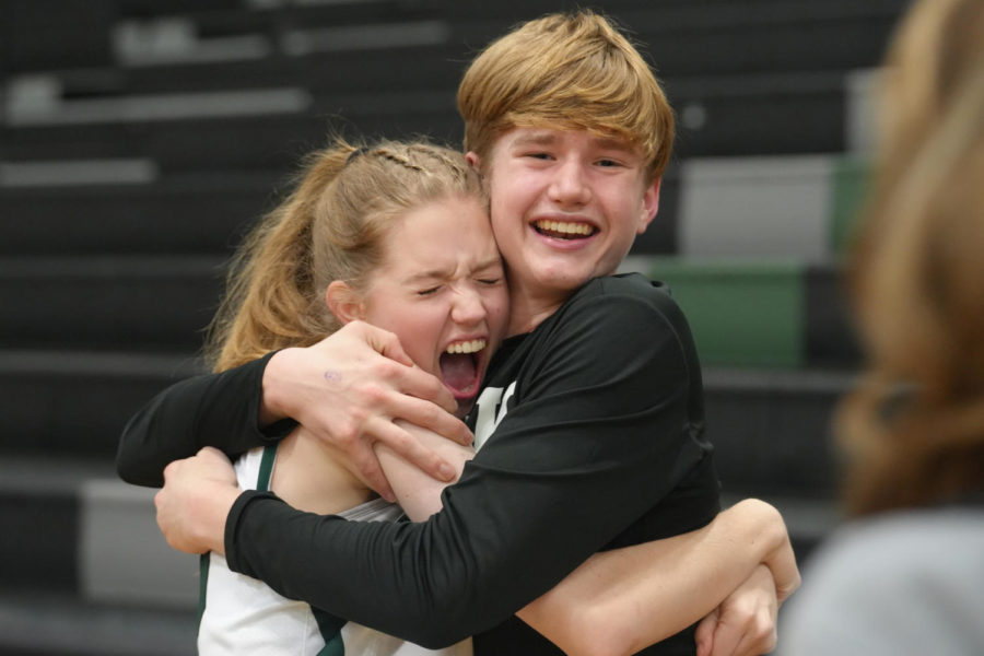 Senior Katie Gerbasich gets a hug from her brother freshman Bryce Gerbasich after the Senior Night ceremony during the basketball season in February.
