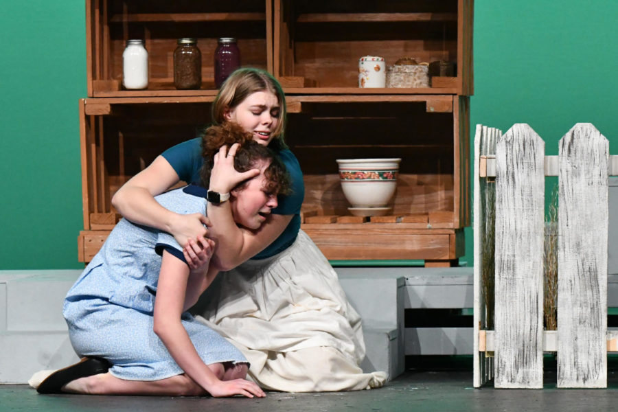 Senior Abigail Hunt comforts Taylor Mattingly during a scene in varsity theaters UIL one-act play The Diviners.