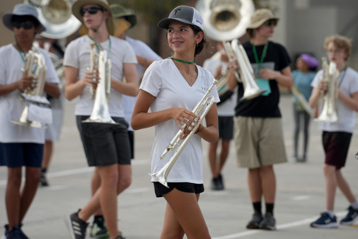 Freshman+Scarlett+Perez+looks+at+the+drum+majors+during+band+practice+on+Aug.+21.
