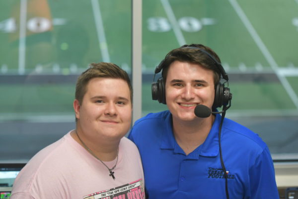 Junior Garrison Moritz and his older brother Gavin hang out before the football teams season opener against MacArthur on Aug. 24. Gavin did play-by-play of the game for Texan Live, while Garrison helped out. 