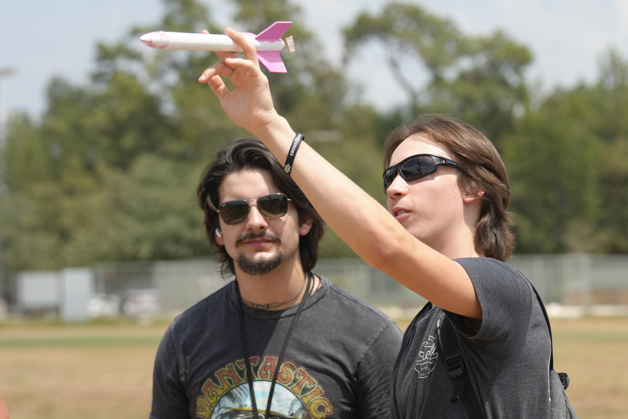 Seniors Mason Green and Brooks Laughlin look over their rocket before they launch it during aeroscience class in August. 
