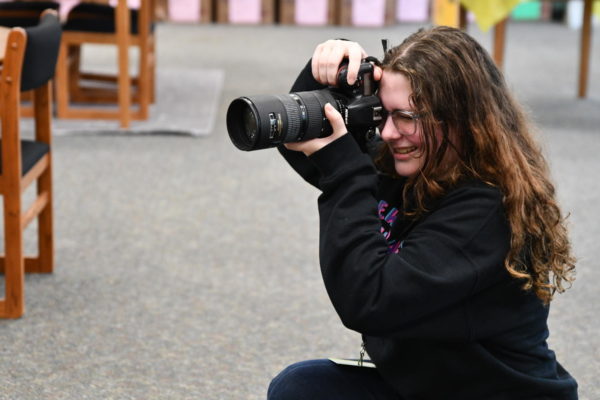 Bailey Hall takes photos of the library for journalism.