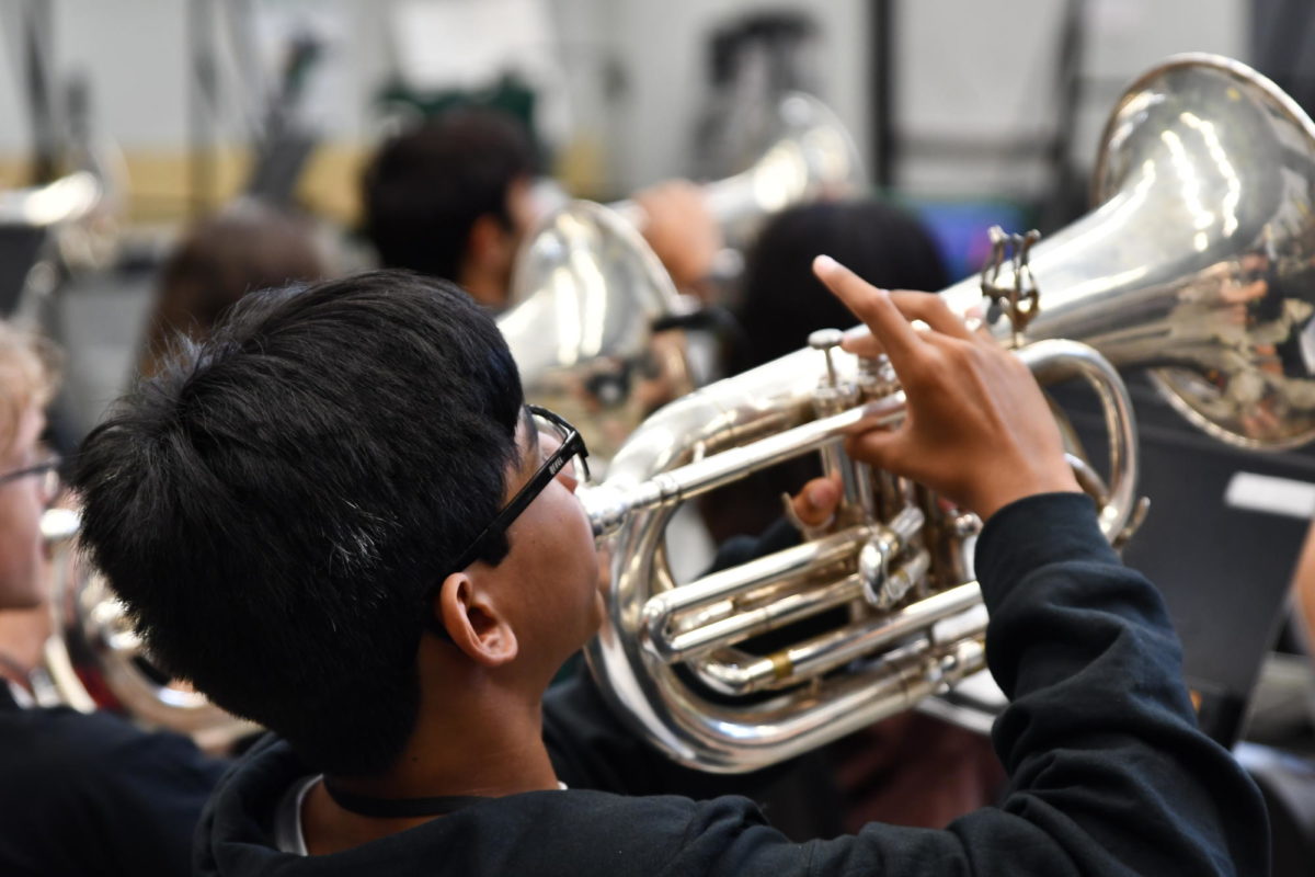 Freshman Elijah Vasquez plays the baritone in the band warm-up during fifth period on Sept. 6. Vasquez can play a wide range of band and orchestra instruments. 