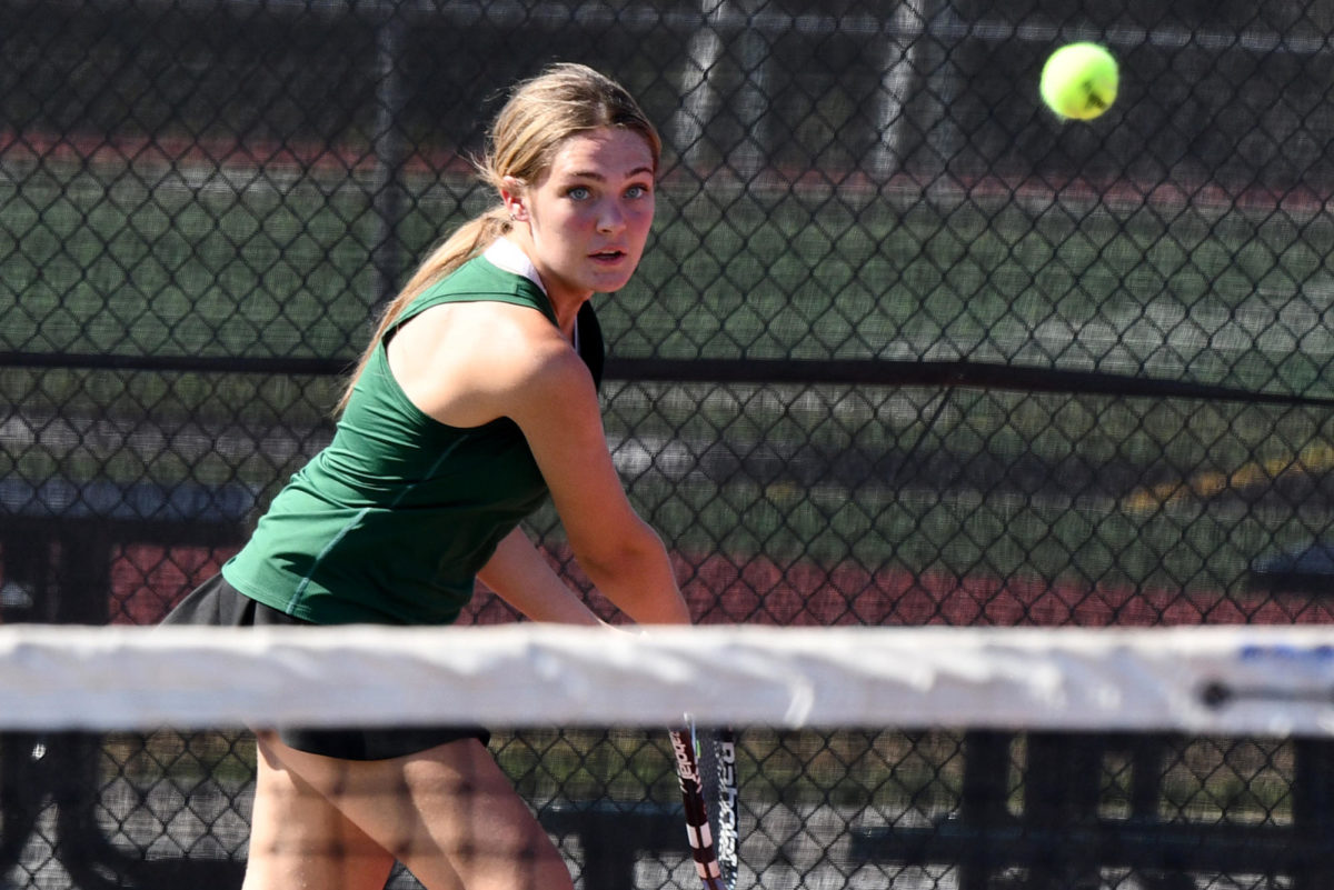 Senior Brooke O’Brien competes in a match against Summer Creek in August. On Sept. 27, OBrien helped lead the tennis team to its second district title in two years.