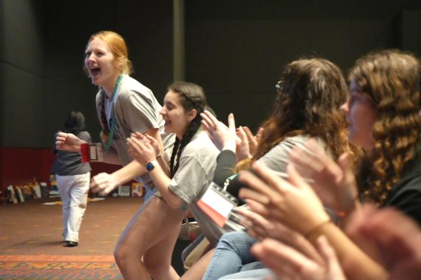 Senior editors Arleigh Doehring and Kara OHara jump up as the yearbook is named first place in Best of Show for yearbooks with 0-260 pages. It was the first time the yearbook took home the top award. 
