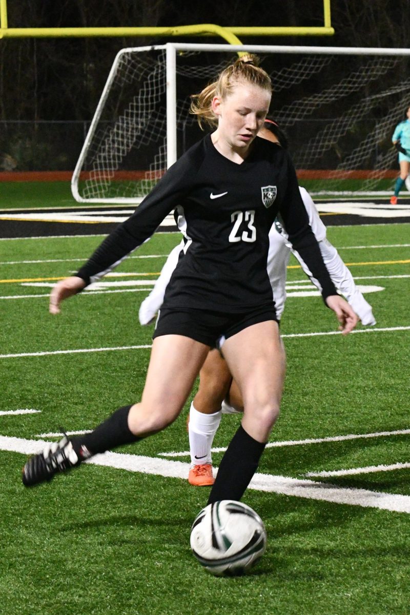 Krisslyn Boyles sets up to the pass the ball against Huntsville on Jan. 7. She has been on the varsity soccer team since her freshman year.