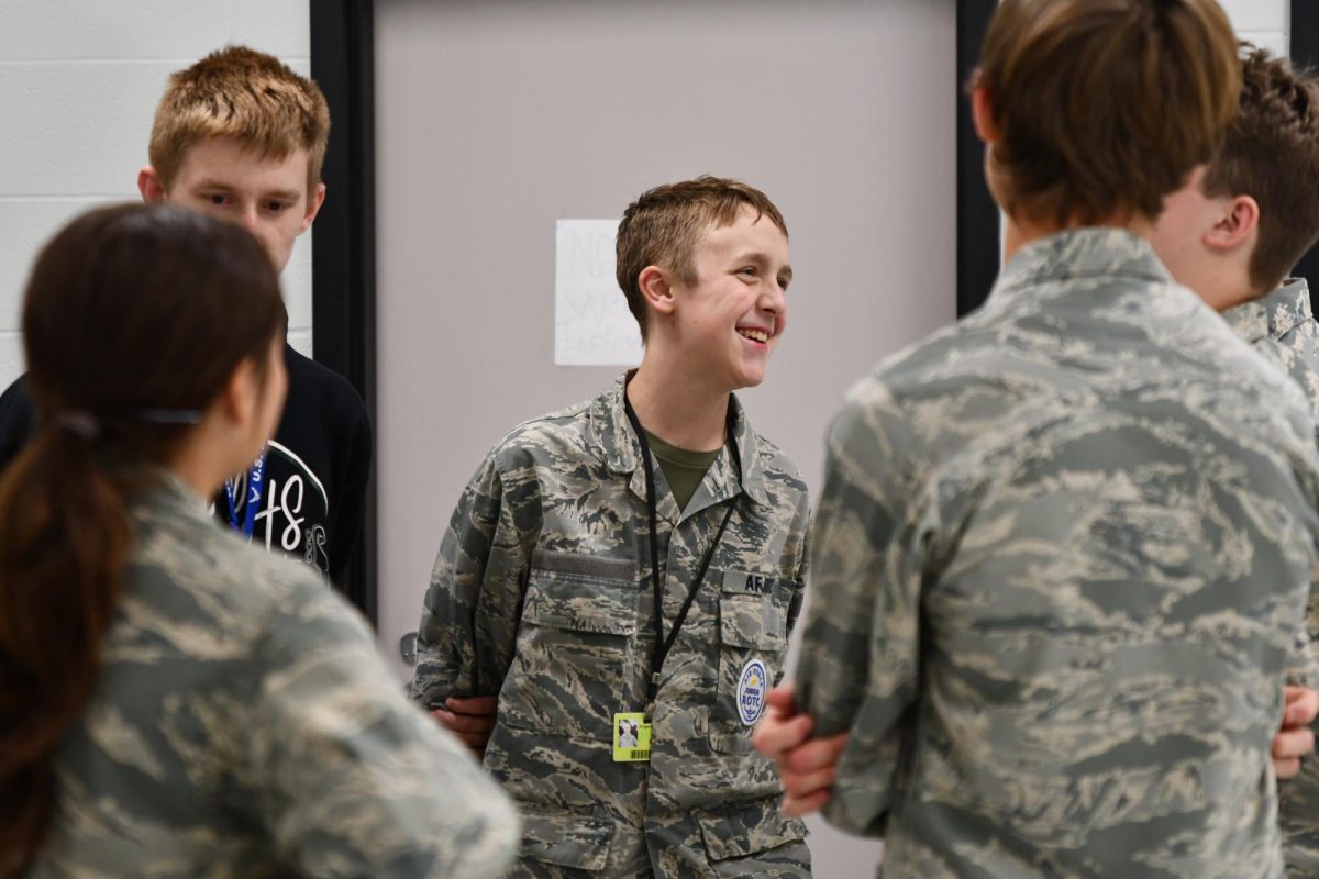 Aiden Gibson, 9, laughs with classmates in JROTC during fifth as the students participate in the prompt of the week during advisory in October. The mandated time each week to have class discussions about bullying, friendships and more has been met with mixed reactions from students. 