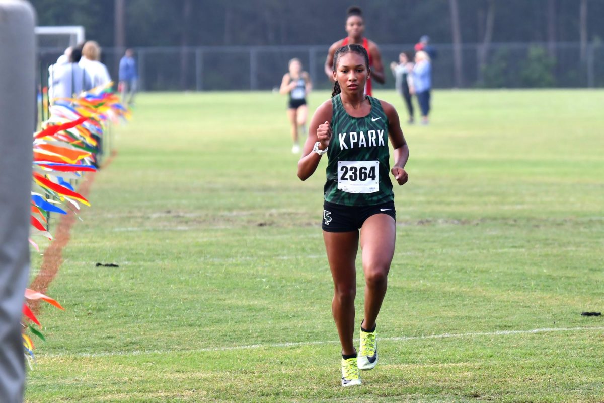 Senior Elina Bailey sprints to the finish in the district cross country meet. She will represent Kingwood Park at the State Meet on Nov. 3. 