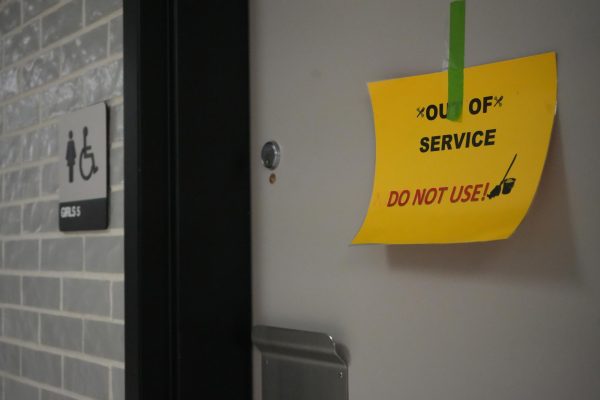 Students are getting used to seeing Out of Service signs on bathroom doors. The building has had plumbing issues for four months.