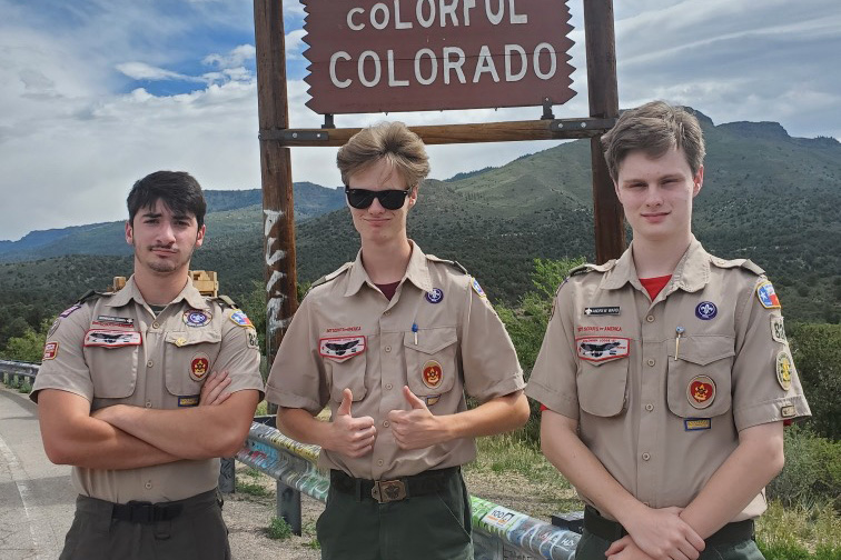 Seniors Forrest Hutchinson, John Ward and Andrew Ward take a photo at the Colorado state line during a trip for the Boy Scouts. Photo submitted by Patricia Huthinson.