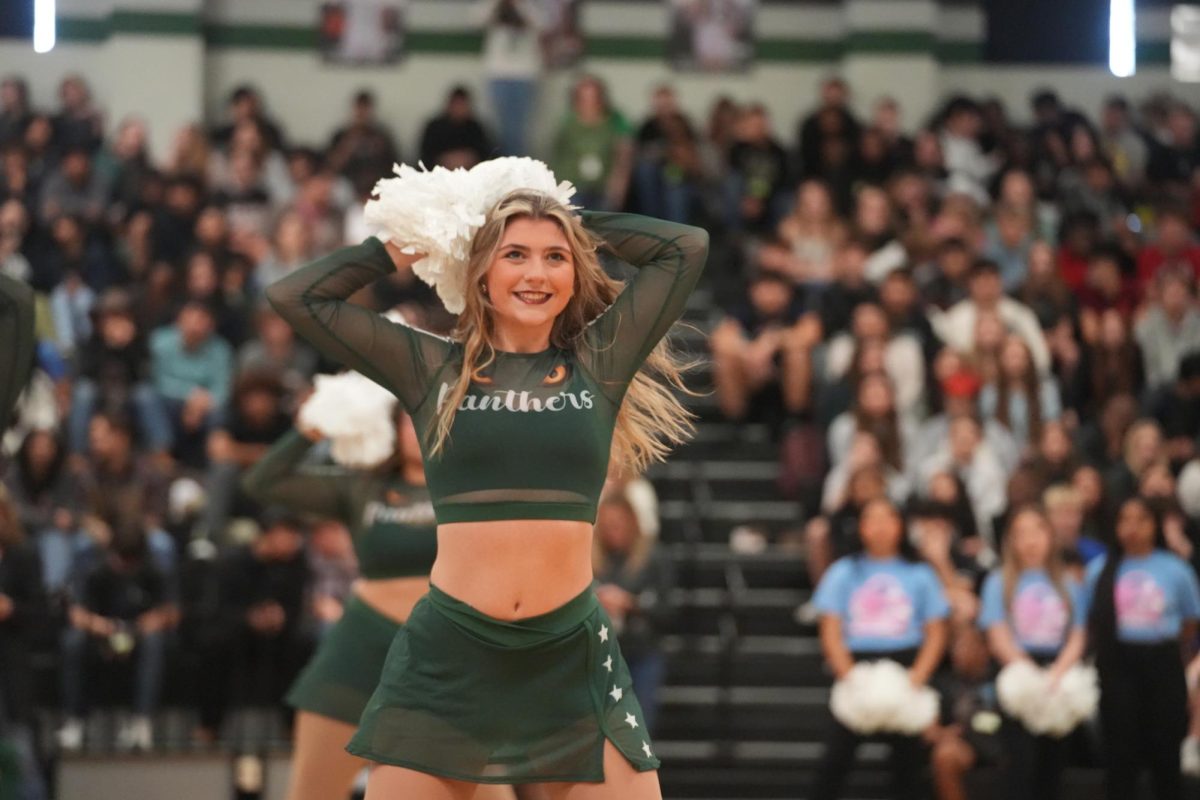 Senior Megan Heginbothem preforms at  pep rally. 