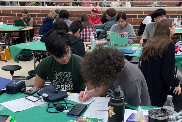 Seniors Vuong Nguyen and Zachary Niesporek work on homework between events at academic team meet at Livingston. Photos contributed by Theresa Robison. 