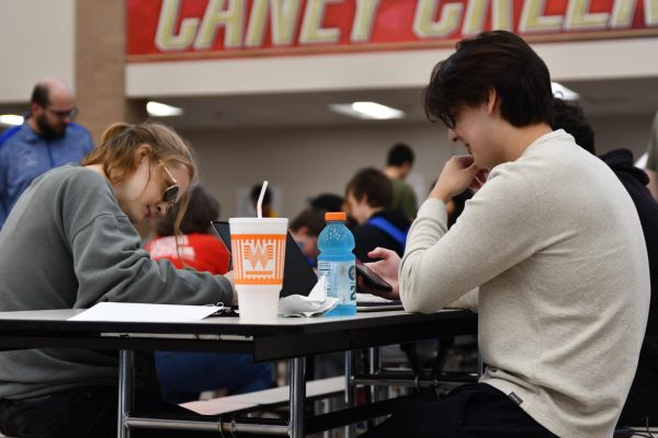 Seniors David Geslison and Max Leal take a break before their computer science event begins at Caney Creek High School on March 2. 