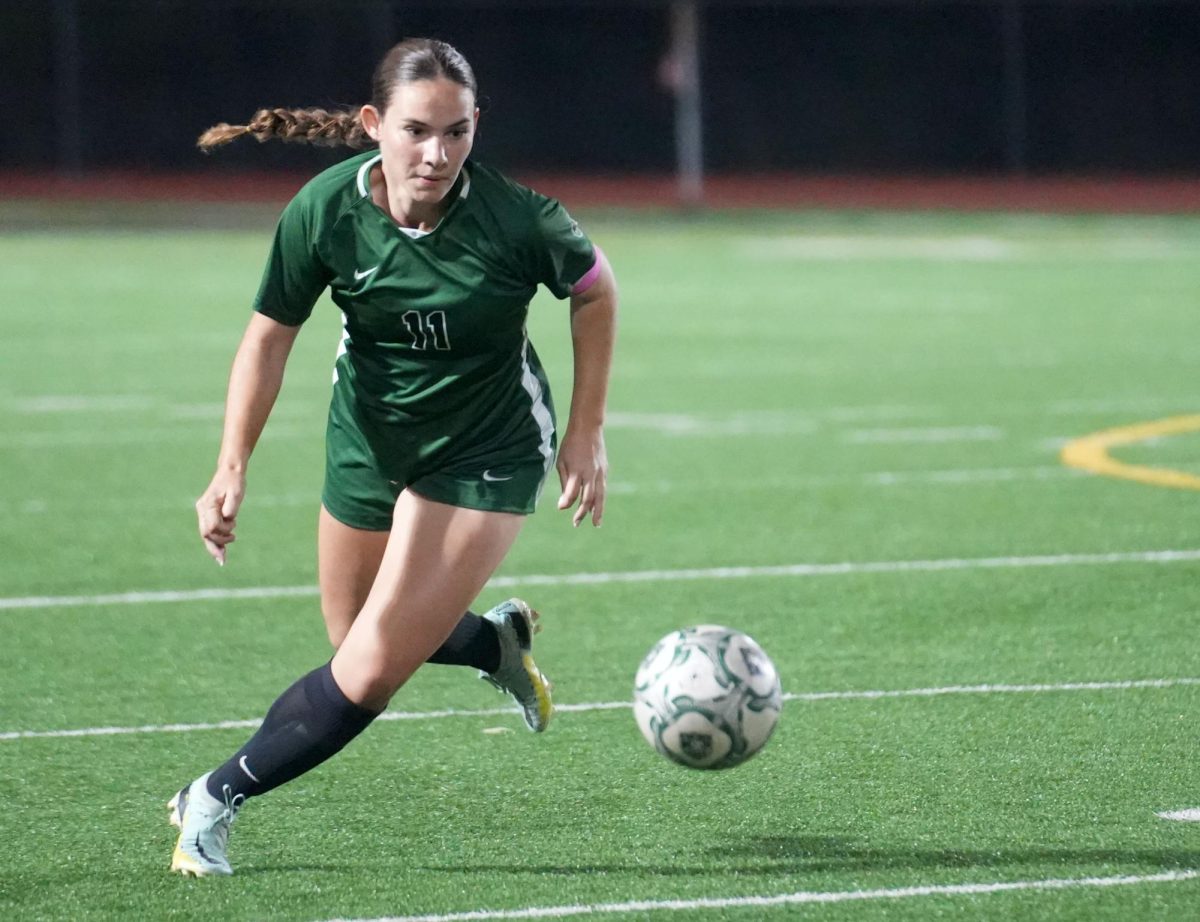 Senior captain Erin McLain moves the ball up the field during the Senior Night game against Lufkin earlier this month.
