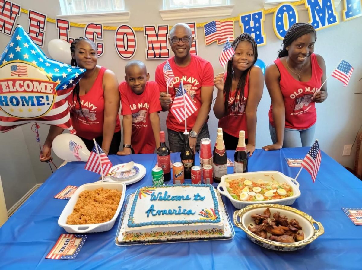 On her first day in America, Victoria Anisi (fourth from the left) enjoys a party with family. Anisi left Nigeria at the age of 14. Photo submitted by Victoria Anisi.