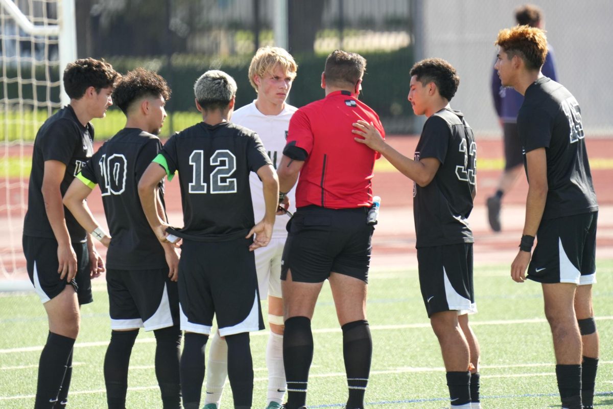Senior Evan Jimerson discusses with the ref about penalty awarded West Mesquite after a Kingwood Park defender slide tackled a forward. The Panthers lost, 4-1, in the Regional Semifinal.
