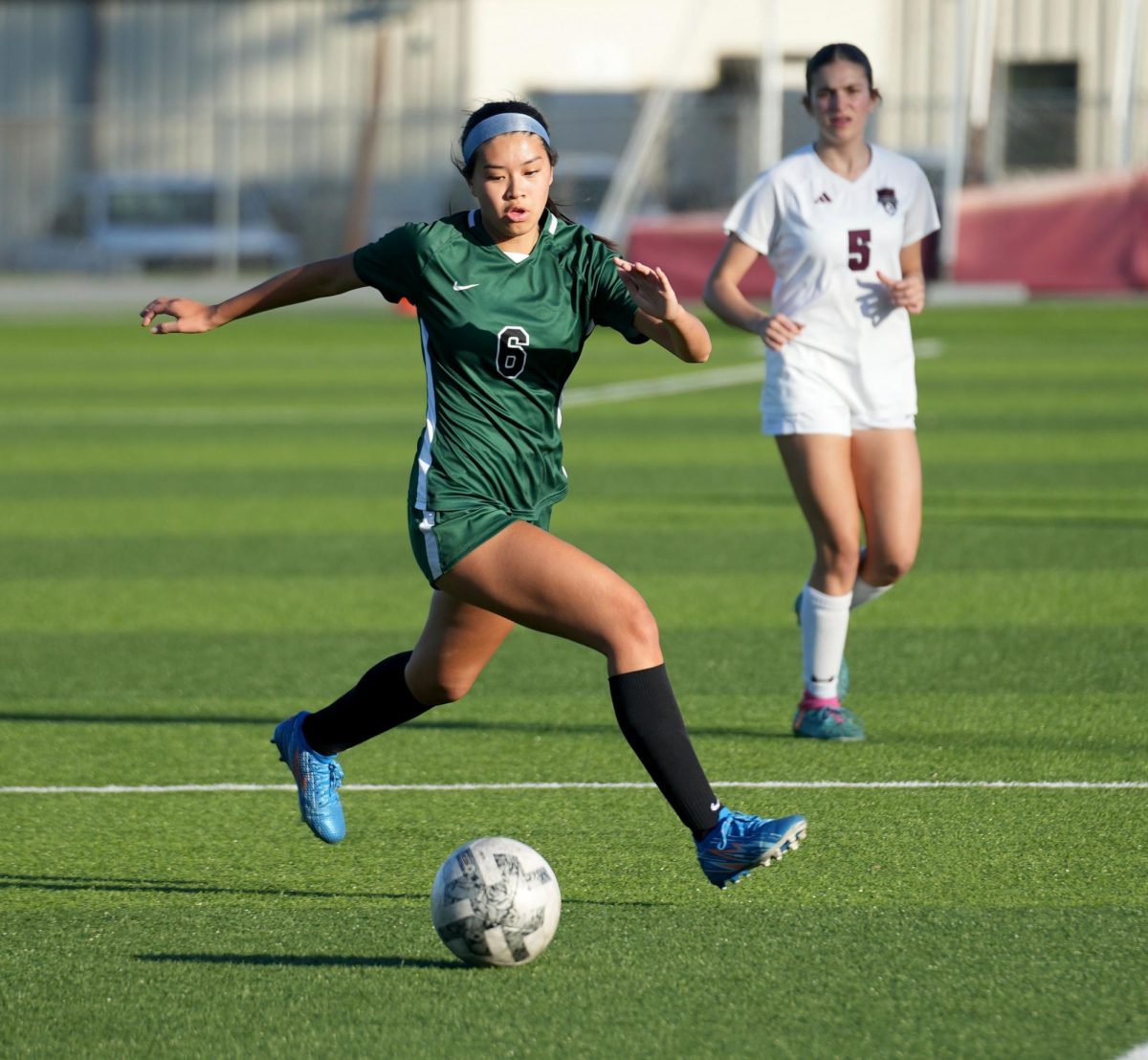 Senior defender Sienna Morales dribbles the ball up the field against Whitehouse on March 26. Morales has been on varsity since she was a sophomore.