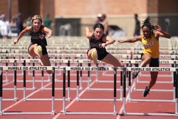 Sophomore Madison Staggs and senior Eva Abshire compete in the 100m hurdles in the Area Meet at Turner Stadium. Abshire qualified for State in the 300m hurdles and competes tonight in Austin.
