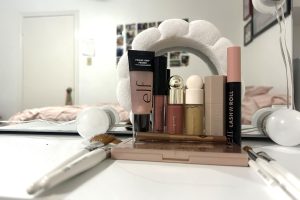 A vanity is filled with makeup.