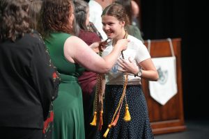 Senior Kayley Warr receives her Science National Honor Society cord from Tara Bailey. 