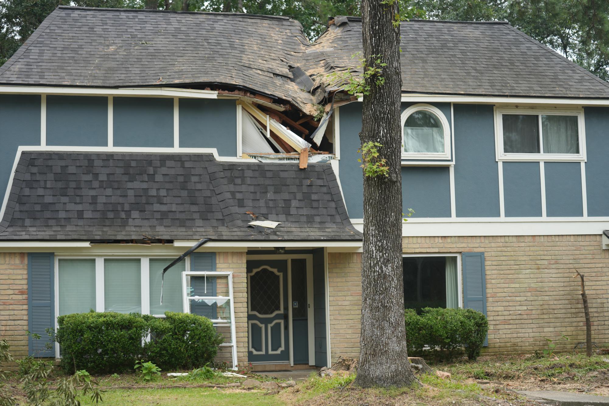 On July 12, tree removal workers successfully removed the tree from the Cavallo house in the Woodland Hills subdivision.