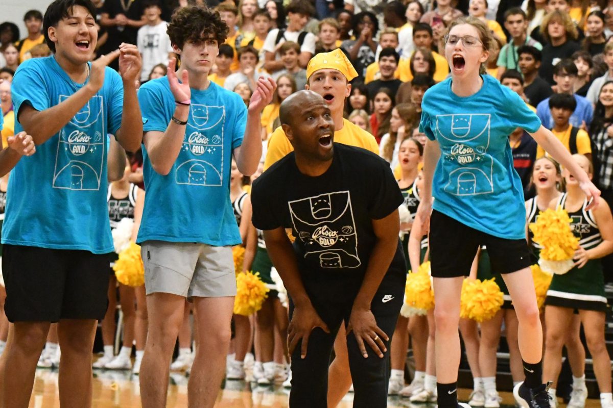 Coach Andrew Cross reacts during the 3-point shootout against the juniors. Cross missed this 3-pointer and junior Jakendrick Clevenger made his to seal the junior class victory. 