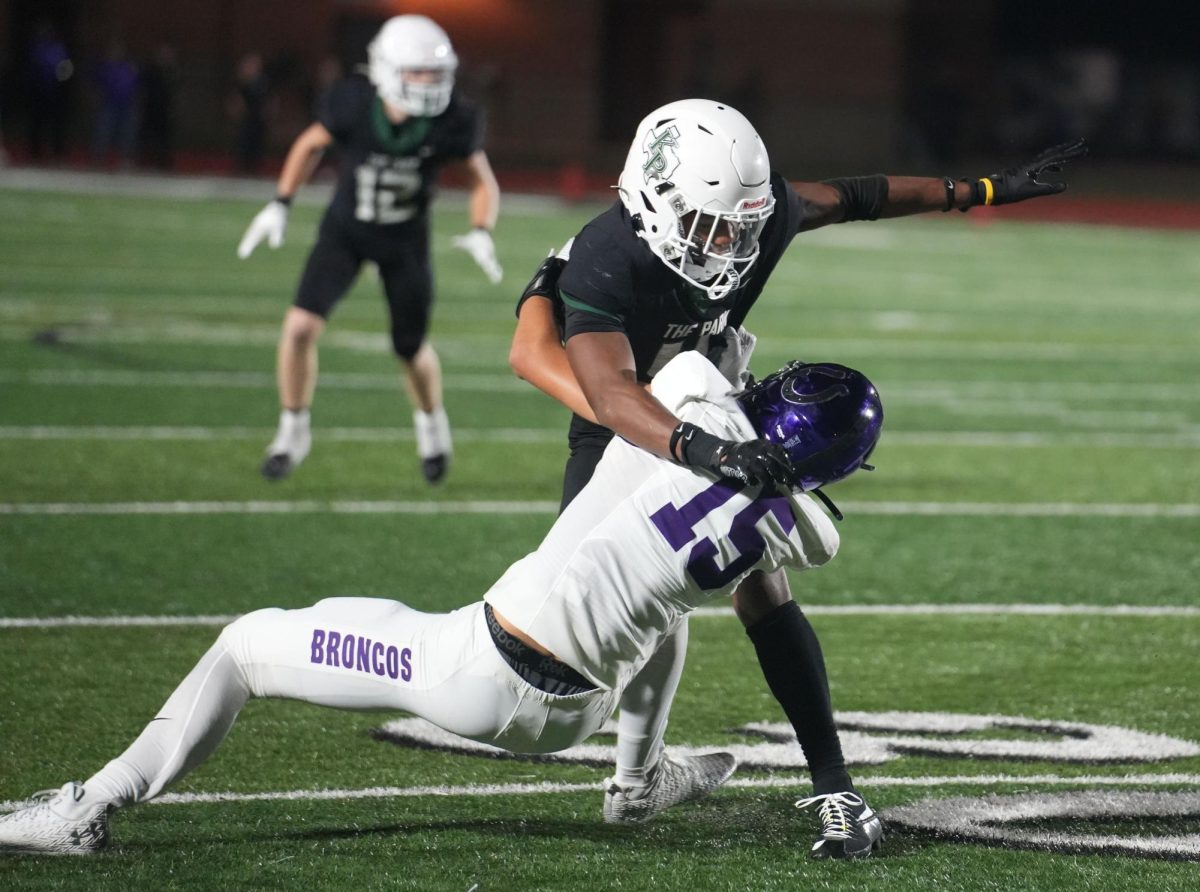 Senior Aaron Andrews blocks an offensive Dayton player on the 30 yard line.