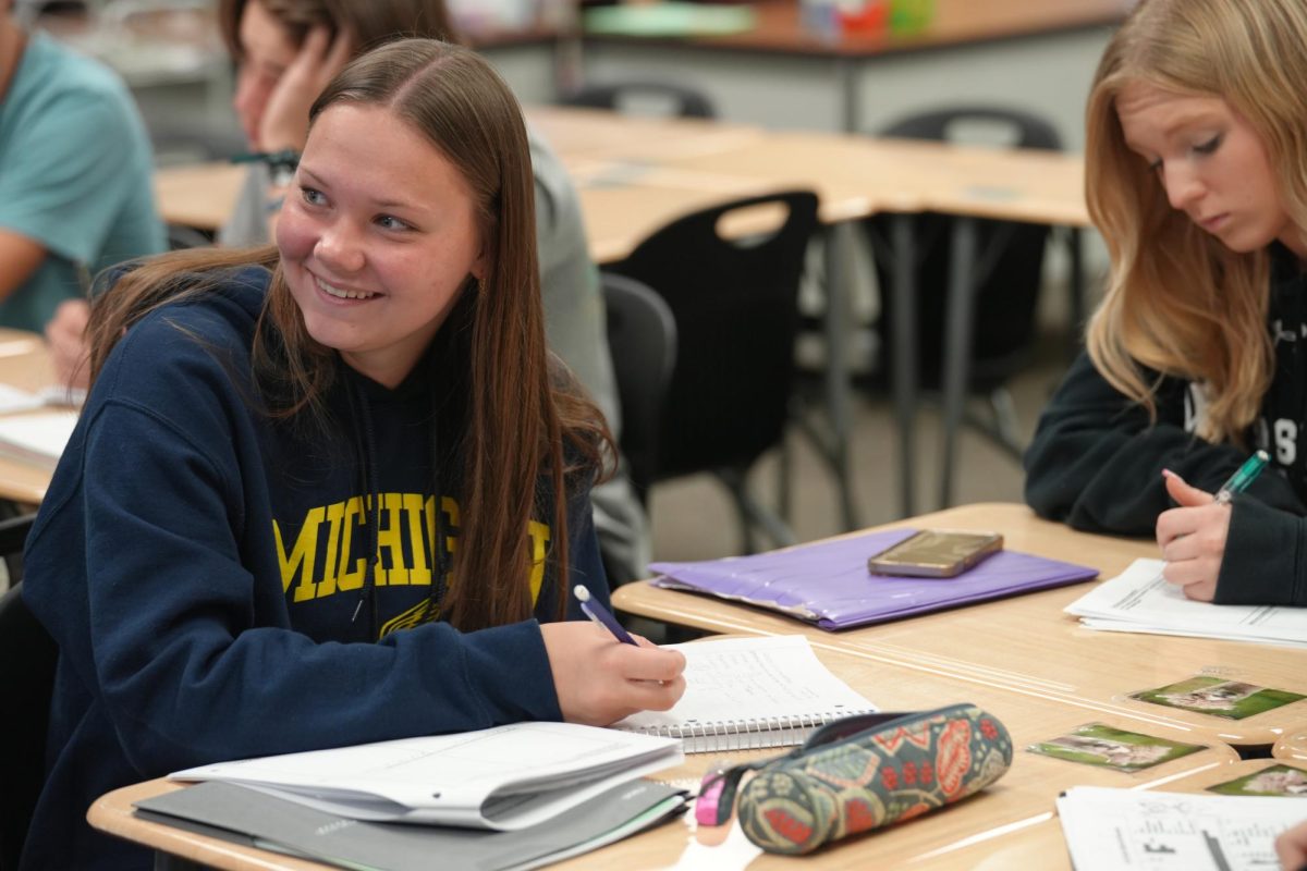 Junior Emilee Smith takes notes on paper during PreCal Dual OnRamps when the internet was out during first period.