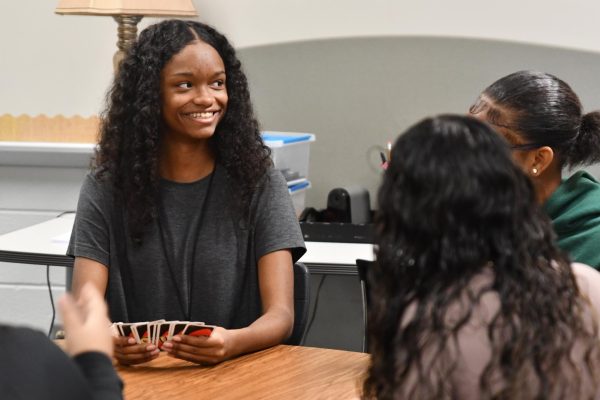 Sophomore Je'La Rendon plays UNO during Child Development class first period because the school was without internet.