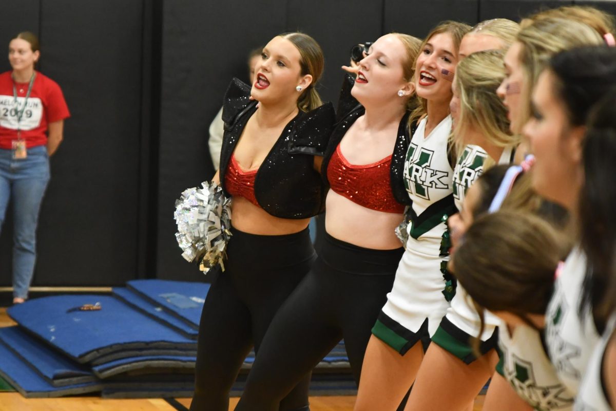 Olivia Horton, Ava Smith, Madison Staggs sing the alma mater together at the end of the Aug. 23 pep rally. 