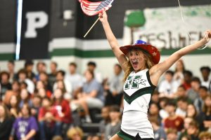 Madison Staggs celebrates on top of the junior class pyramid. The juniors won the competition. 