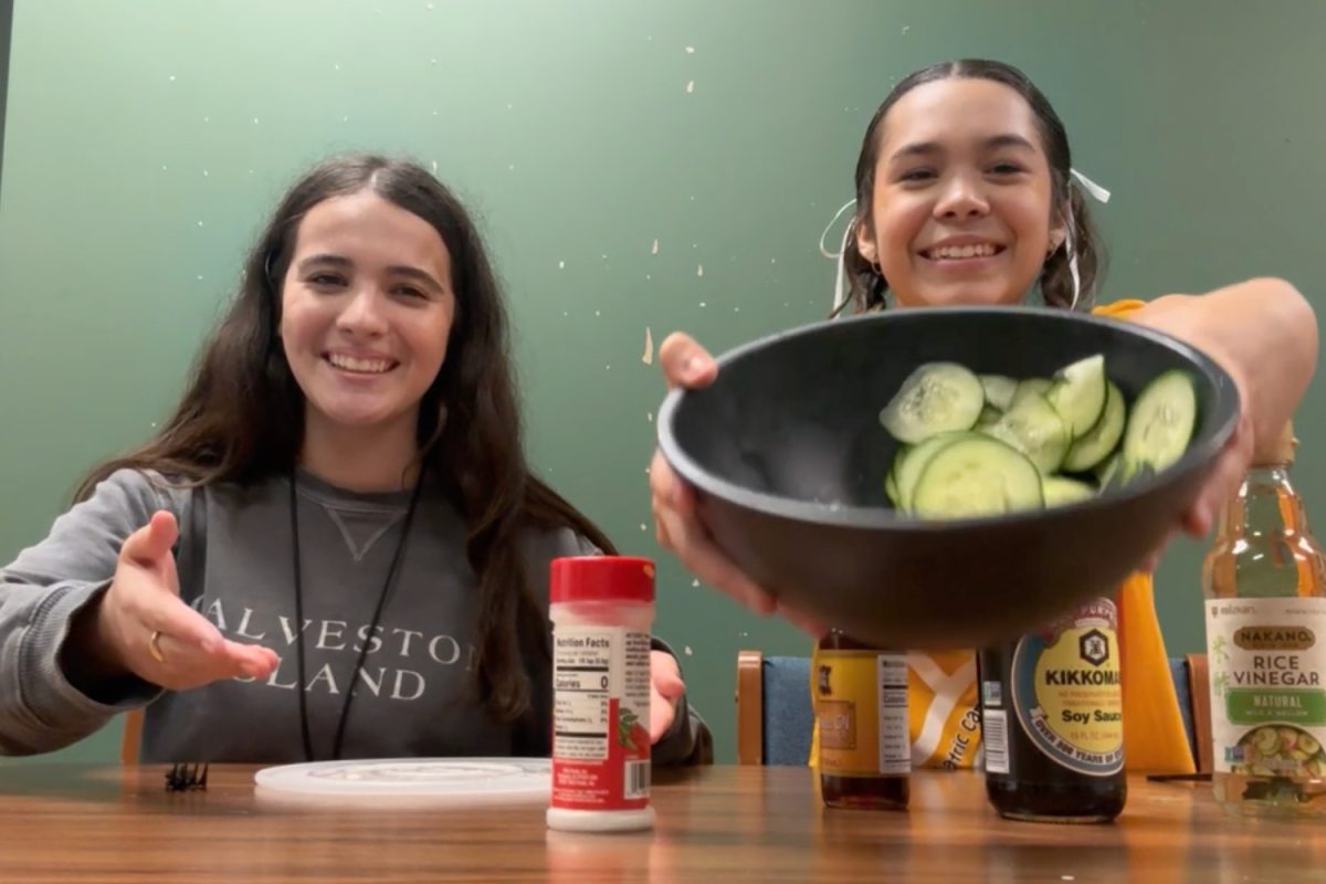 Pilar Retamales and Danielle Nalley participate in the cucumber salad challenge. 