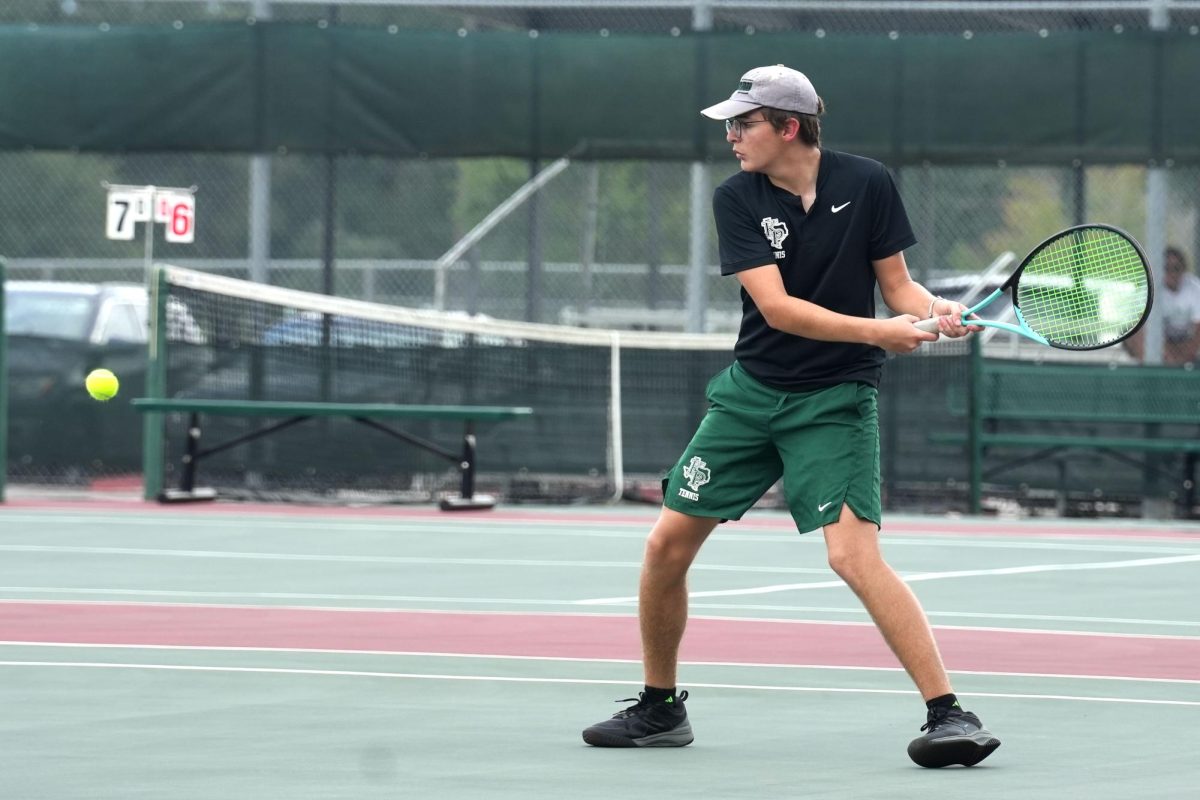 Senior Charles Meaux hits a backhand shot in a singles match against Pasadena on Sep. 10.