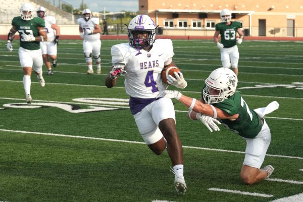 Junior Cooper Robinson reaches to attempt to tackle a Montgomery player during their game on Aug. 31.