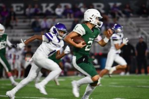 Freshman Jon Pavlatos runs the ball in the JV A game against Angleton on Oct. 17.