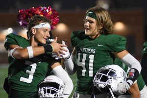 Seniors Alex Hartnett and Isaac Lee share a handshake before taking the field against Pasadena on Oct. 24. 